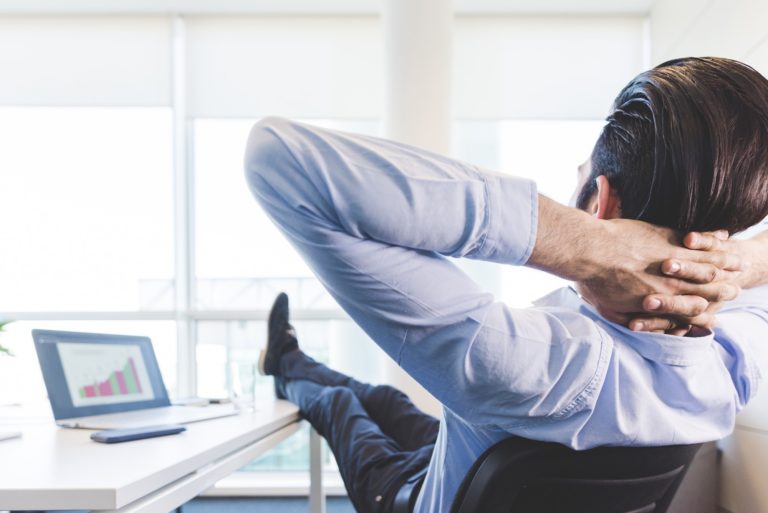 Young indian businessman relaxing office